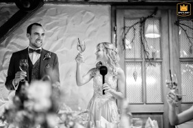 At the Obsthof Jäck in Schriesheim, Germany, the groom makes a hilarious, exaggerated funny expression while reacting to a moment in the bride's speech during the reception.